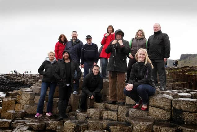 Australia and New Zealand travel agents and tour operators at the Giants Causeway, with Fiona Clelland, Tourism Ireland (front, right); and tour guide Conor Ellard (back, right).