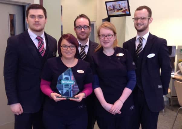 Specsavers Larne staff, from  left, Lance Agnew, Nicole White, Glenn Haveron, Julie Millar and Chris Cornhill are pictured with the Excellence in Customer Service Award. INLT 20-660-CON