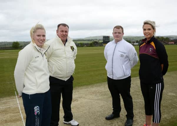 Team captains Emma Allen, left, Fox Lodge, and Jemma Rankin, Bready, pictured with match umpires Garth Watson and Stephen Kennedy, before the start of their Derry Mid-Week Charity Ladies Cup match at Bready Cricket Club on Sunday. INLS2115-130KM