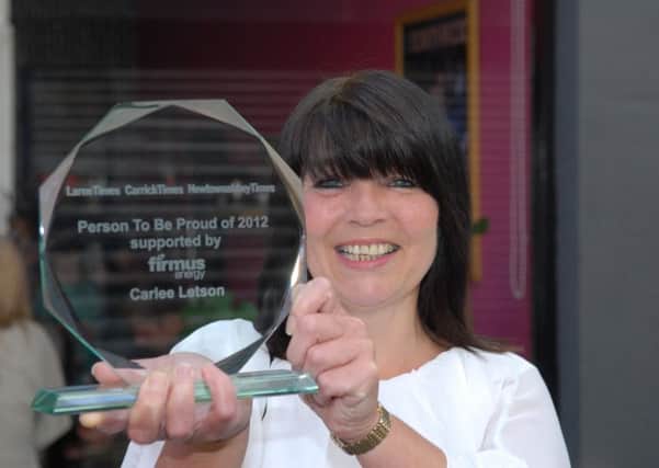 Carlee Letson of PIPS, Larne, with the Larne/Carrickfergus and Newtownabbey Times "Person To Be Proud of 2012" trophy sponsored by Firmus Energy. INLT 31-309-PR
