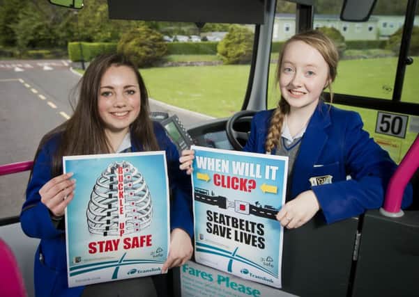 Year 11 pupils from St Killian's College, Christina McCambridge and Hannah Craig, are pictured with their artwork, which features as part of Translink's seatbelt safety campaign.  INLT 21-677-CON