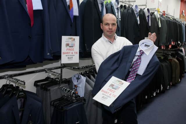 Peter Stevenson of Wallace's promoting the free shirt and tie offer with every suit bought. INBT22-212AC