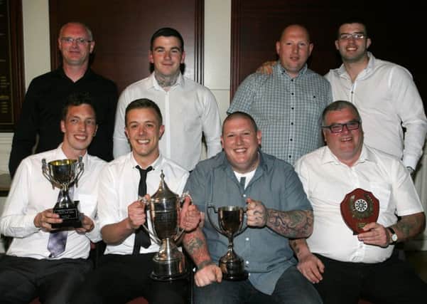 The Spinning Mill team who received the 3-a-sides, Pairs, Loyalist Cup and second divison trophy at the Ballymena Darts League dinner. INBT22-256AC
