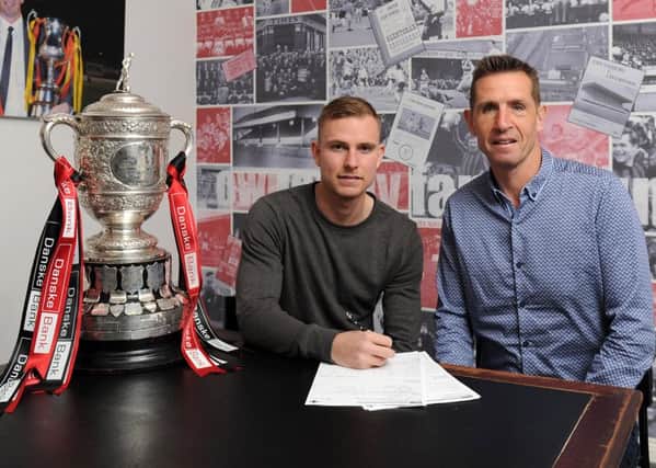 Crusaders manager, Stephen Baxter (right) with new signing Andrew Mitchell.