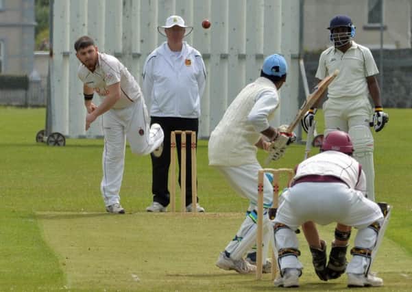 Larne Cricket Club captain, Chris Dempsey bowling against BISC. INLT 21-025-PSB