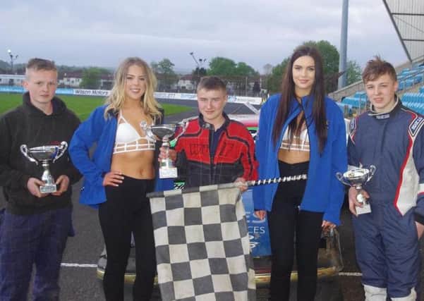 Top three finishers in the Junior Rod Supreme Championship receive their awards from grid girls Shannon and Natasha. Pic: Davy Park.