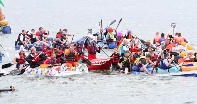 The rafts group up during the Portrush Raft Race on Saturday. INCR22-347PL
