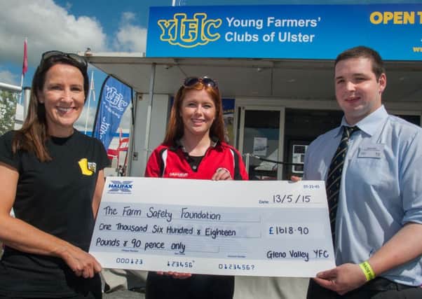Chloe McIlwaine, Gleno Valley YFC, presents Stephanie Berkeley, of Farm Safety Foundation, with a cheque for £1,600, after Chloe and the relay team from Gleno Valley completed the Belfast Marathon. Also pictured is Brooks Allen, YFCU vice-president. INLT 21-658-CON