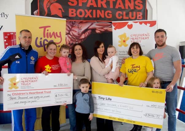 Rab Mitchell, Alison Crawford from the Children's Heartbeat Trust, Rosie, Emeria and PJ McClaughan, Caitlyn Parker, Stephanie McCaig, Gillian Breen from Tiny life and Willy Thompson from Ballyclare Spartans. INNT 21-052-GR