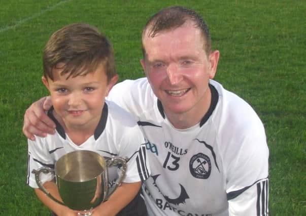 David Wilson Armagh Minors assistant manager with his son Conail.
