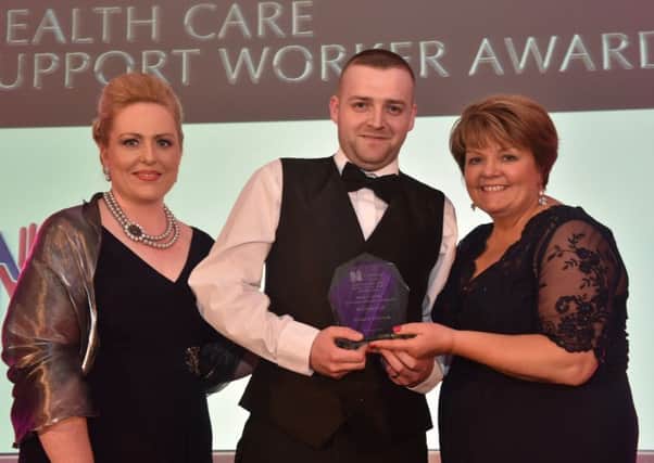 Brenda McIlmurray (left), RCN, Richard McCrum, runner-up of the Health Care Support Workers Award and Janice Smyth, director of the RCN in Northern Ireland. INCT 21-756-CON