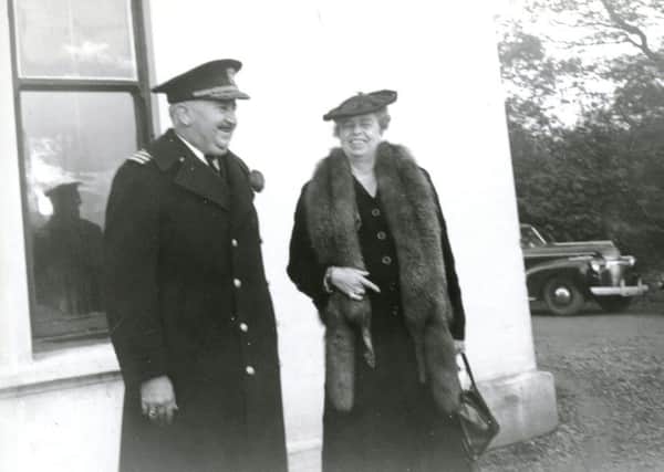 A candid photograph from November 11, 1942, with the First Lady of the United States, Mrs Eleanor Roosevelt, standing in front of Springtown House, sharing a joke with the Commandant of the US Naval Operating Base, Captain Van Lear Kirkman, a native of Tennessee. While in Derry, Mrs Roosevelt took part in the events to mark Armistice Day and the US Marines birthday.