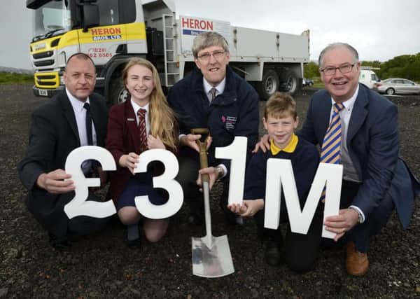 Education Minister John O'Dowd MLA,with, from left, Patrick Allen, Headmaster of Foyle College, Kacey Laird,pupil, Luke Pentland, a P5 pupil at Ebrington Primary School, and Nigel Dougherty, Principal of Ebrington Primary INLS2215-106KM