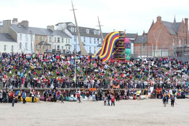 Large crowd watches the Portrush Raft Race on Saturday. INCR22-336PL