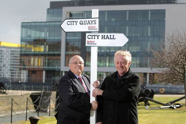A sign of things to come.  Roy Adair, Belfast Harbour CEO, and Dennis Davidson, CEO of Banbridge-based Gibson Ltd, mark work on a new £1.2m, 1.2km long waterfront walkway linking the Harbour's City Quays development to Belfast city centre. Pic: Brian Thompson Photography