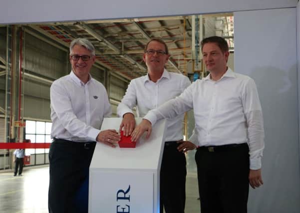 Mark Nodder, CEO Wrights Group, Hartmut Schick, Head of Daimler Buses, and Markus Villinger, Managing Director Daimler Buses India (from left to right), inaugurate the new bus plant.