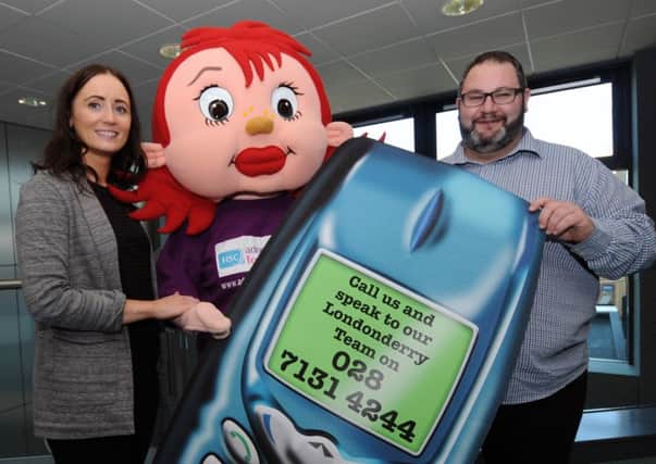 Launching Foster Care Fortnight (June 1 - June 14) are Karen Fox and Quintin O'Kane from the Western Trust's Fostering Recruitment and Assessment Team along with the fostering mascot.