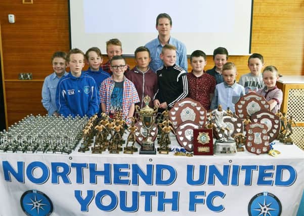 Alan Bristow (coach) with the Northend U-10 squad at the club's prize night. INBT 23-808H