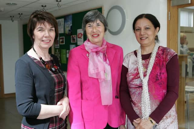 WELCOME. Peace Group Chair, Eleanor Duff, welcomes guest speakers, Mary McNickle, Causeway Volunteer Centre and Indu Jairath of the Asian 50 plus club Coleraine to their AGM in the Dunluce Parish Hall.INBM23-15 072SC