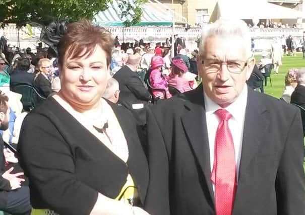 BEM recipient Trevor Crawford from Broughshane and his daughter Janice Butler pictured at  Buckingham  Palace  on Thursday. (Submitted Picture).
