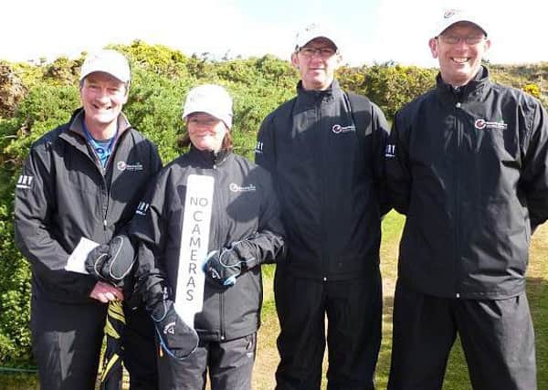 Four members of the 17 strong team of Banbridge club members who officiated at the 4th hole during the Irish Open. Donald and Jane Doyle, John Bell and Neill Madeley.