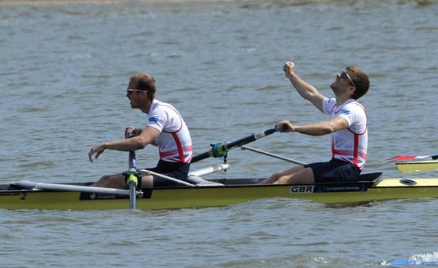 Great Britain's Joel Cassels, right, and Peter Chambers celebrate as they win the Lightweight Men's Pair final during the European Rowing Championships  in Poznan, Poland, Sunday, May 31, 2015. (AP Photo/Alik Keplicz)