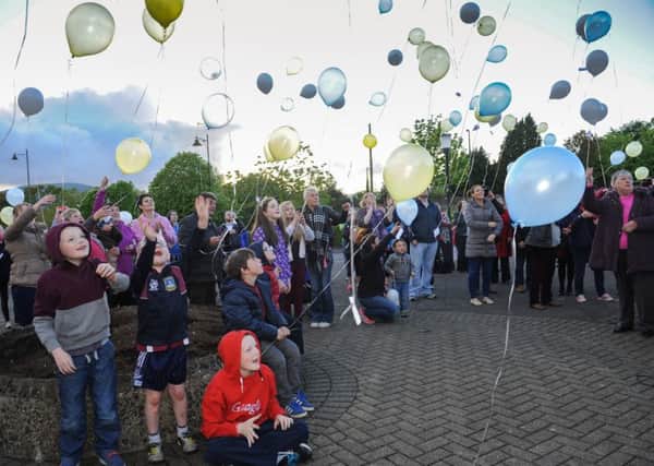 The balloons are released into the evening sky at the Balloon Release held in Draperstown, and organised by STEPS, in memory of all those who lost their life through suicide. INMM21-513.