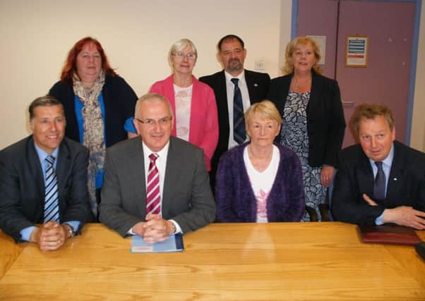 Minister Danny Kennedy (seated second from left) with Danny Kinahan MP (right), Paul Girvan MLA (left) and members of Ballyclare and District Policing and Community Forum. INNT 23-503CON