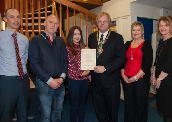 Level 3 Travel & Tourism student Danielle McNeill receives her Certificate from Sir David Wootton (Governor of The Honourable the Irish Society).  Also pictured, from left, are Course Tutor, Richard Hasson, parents Robert McNeill and Sandra McNeill and Wendy Gallagher (Tutor).
