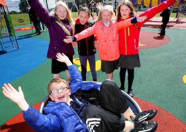 Conlon O'Rourke  (8)  and friends from Silverstream Primary School enjoying the new play area. INCT 22-794-CON