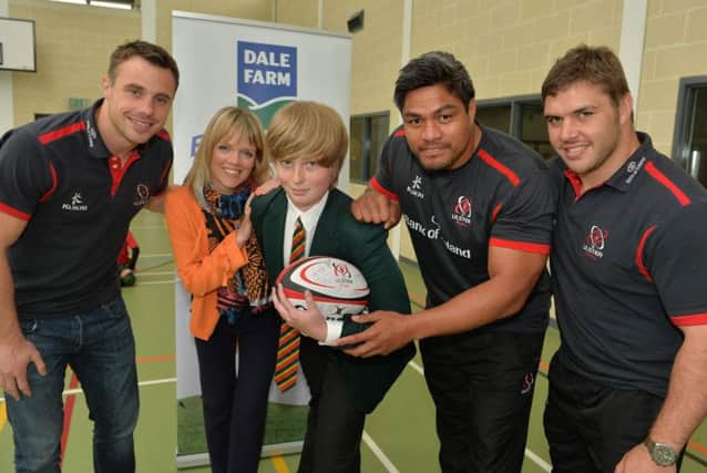 At Friends School, Lisburn are Ulster Rugbys Tommy Bowe, Nick Williams and Wiehahn Herbst with competition winner Jack Simpson and Caroline Martin, Head of Marketing, Dale Farm.