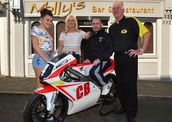 The Armoy Road Racing Club has just announced a new sponsor for the Moto3 GP 125cc Race, Mollys Bar and Restaurant of Ballymoney. Standing in front of Mollys Bar and Restaurant is daughter of Sammy and Shelley Mullan, Molly Mullan and her friend, Zoe Wallace with Road Racer Paul Robinson and Bill Kennedy, Clerk of the Course at Armoy Road Races. Bike Week runs from Sunday 19th July until Saturday 25th July 2015 with the SGS International Race of Legends featuring on the Saturday 25th July 2015.