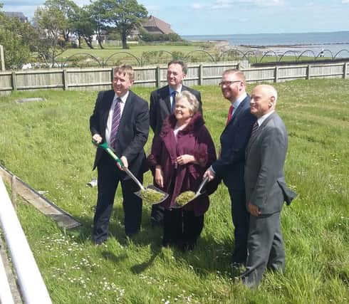Health Minister Simon Hamilton and his Social Development counterpart Mervyn Storey cutting the first sod at the former Greenisland House site. INCT 23-706-CON
