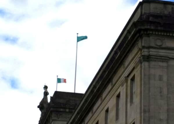 An Irish Tricolour over Parliament Buildings in Belfast on June 3