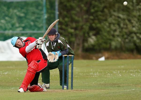 Knocked for six! Drummond's Kyle Morrow notches up a boundray against Downpatrick on Saturday. INLV2415-498KDR