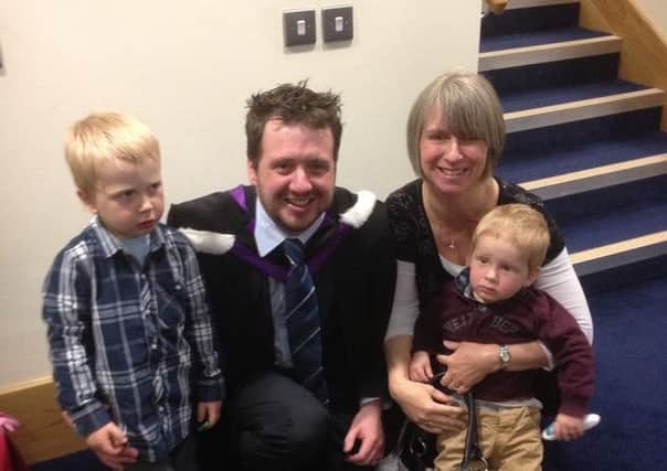 Ross Kernohan, who was licensed for the Presbyterian Ministry on Sunday night is pictured at his graduation from Union Theological College with his wife, Fanny and sons, Benjamin and  Jakob  INBT-24F-ROSS KERNOHAN INSTALLATION. (Submitted picture).
