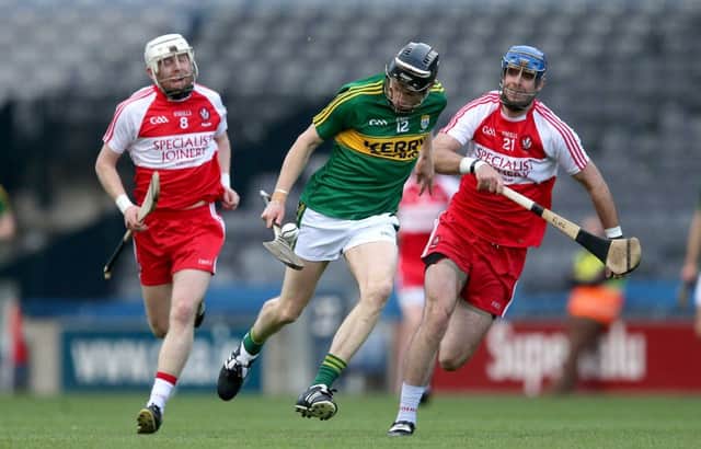 Kerry's Colum Harty tries to get away from Derry's Liam Hinphey in Croke Parky. (Photo:Ryan Byrne - INPHO)
