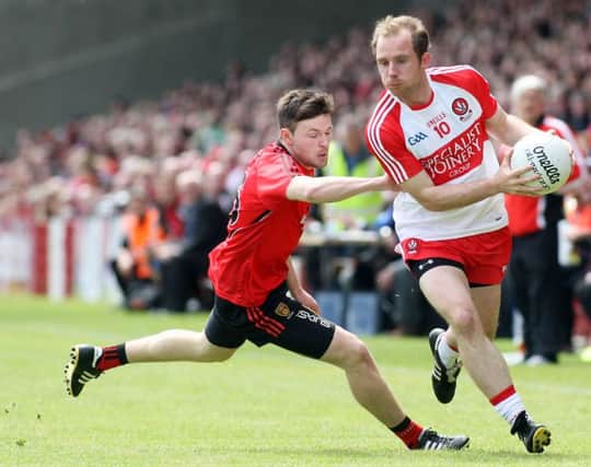 Derry's Sean Leo McGoldrick takes on Down's Donal O'Hare in Celtic Park.


 (Photo Lorcan Doherty / Presseye.com)