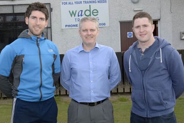 Banbridge Towns new signing Neil Barr (right) with  Manager Ryan Watson (centre)  and Kevin Anderson, who signed for the club last week. INBL1523-220EB