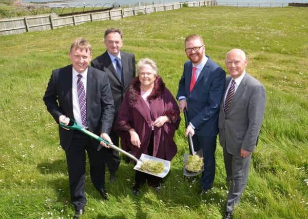 Mervyn Storey MLA, Bob McCann (chairman of Northern Health and Care Trust), Joan Cosgrove (stakeholder), Simon Hamilton (Health Minister) and Timothy Quinn (chairman of Oaklee Trinity) cutting the first sod of the new supported living project at Greenisland House. INCT 23-024-GR