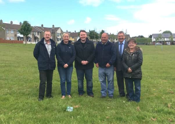 Cllr Stephen Ross, Alderman Pamela Barr and Sammy Wilson MP with Monkstown Community Association representatives Mark Cooper, David McCrea and Anne Judson at the site on Devenish Drive where 12 new houses are to be built. INNT 24-544CON
