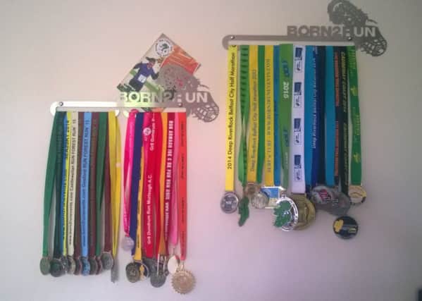 Gillian's extensive collection of running medals.