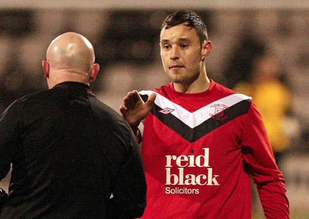 Carrick Rangers have signed Andrew Doyle from Ballyclare Comrades.