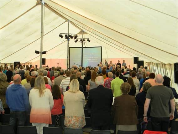 The large crowd enjoying worship at the Big Tent 4 Night Gospel Crusade last year. INBM25-15