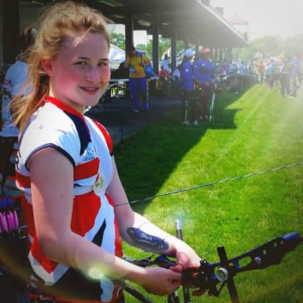 Aimee Convery getting used to her borrowed bow for the World Championships.