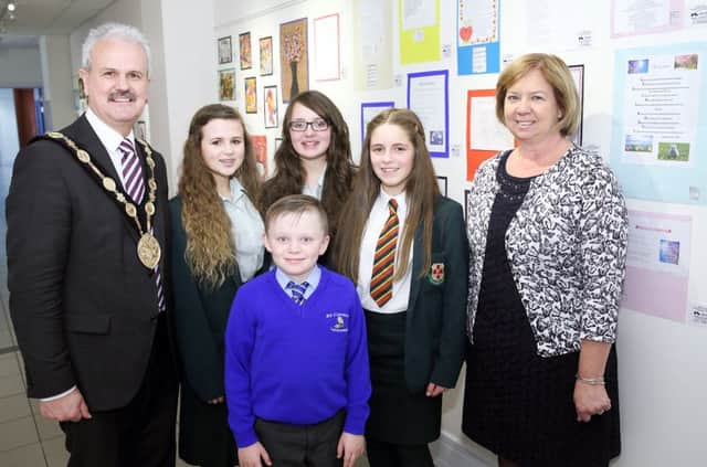 Mayor Thomas Beckett and Eileen Boylan from Montupet, sponsor, with Friends pupils Rebecca McNeill, Rachael Acheson and Lea Carson, and St Colman's pupil Conor Delaney, winners of outstanding individual awards for art. US1523-507cd  Picture: Cliff Donaldson