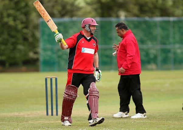 Andy Christie acknowledges his 50 runs for Drummond against Downpatrick on Saturday. INLV2415-516KDR