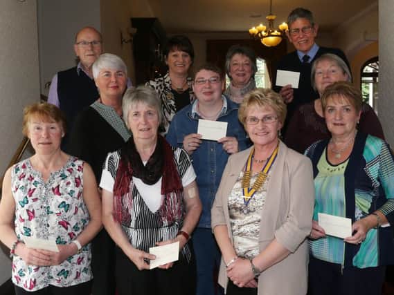 President of Ballymena Inner Wheel Patricia Perry and committee members who presented cheques to local charities at their AGM in Leighinmohr House Hotel. Included are Maureen Giles (Hospice), Brigeena McGookin (Hospice),  Dorris Atkinson (Gateway), Sarah Perry (Crocus), Mary McNeilly (Gateway), Jim McGookin (Hospice), Sam Simpson (RNLI) and Inner Wheel Committee members Heather Stafford (treasurer), Ann Crawford (District Treasurer), Pamela Boreland (Incoming District Chairperson). INBT 25-108JC