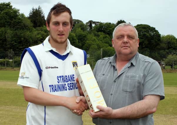 Gary McClintock receives the Danske Bank Player of the Round award from Lawrence Moore of NWCU