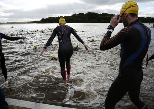 The triathletes take to the water for the start of Sunday's race at the Foyle Pontoon.